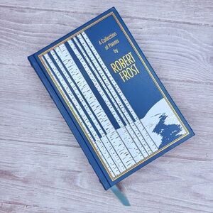A collection of Robert frost blue and gold coffee table book of poems 2019 book